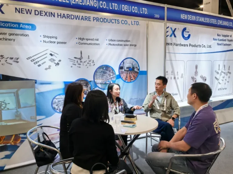 Deli-Newdexin team meeting with clients at International Fastener Expo 2024 booth.
